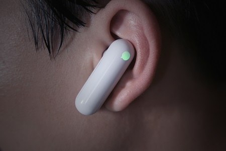 WT2 translator earphones fit in a user's ear, looking no odder than a Bluetooth hands-free device. Source: Timekettle