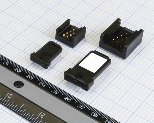 Shown next to a ruler for scale, Mini-Bar products (left) and Bar products (right) are placed side-by-side for comparison. The 60% reduction in size makes the Mini-Bar an ideal choice for mobile and hand-held embedded applications. Source: ATEK Access Technologies