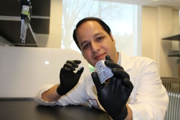 Dr. Rahim Esfandyarpour and the biochip he helped create for just a penny. Credit: Zahra Koochak/Stanford 