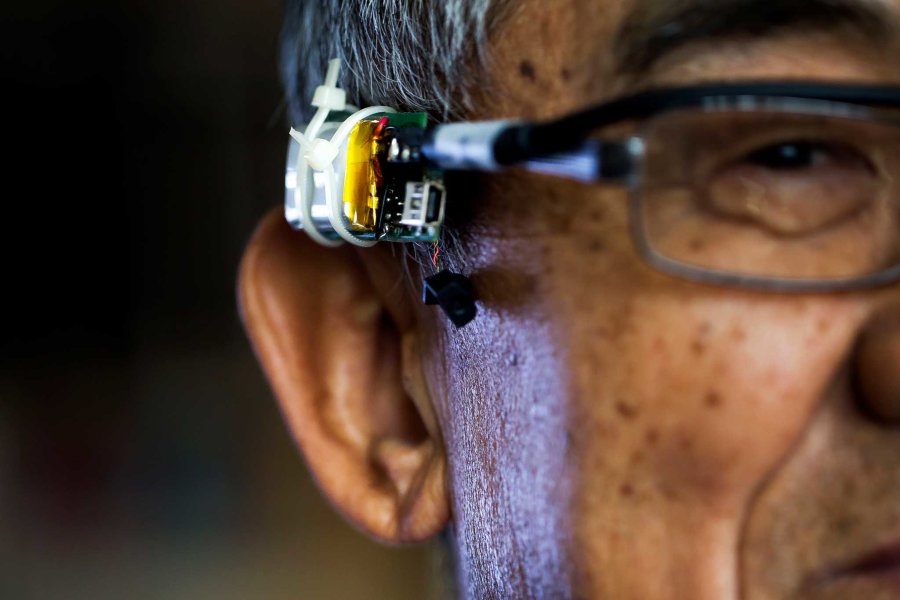 Kang Shin demonstrates VAuth, a wearable voice authentication device. Source: Joseph Xu/Michigan Engineering