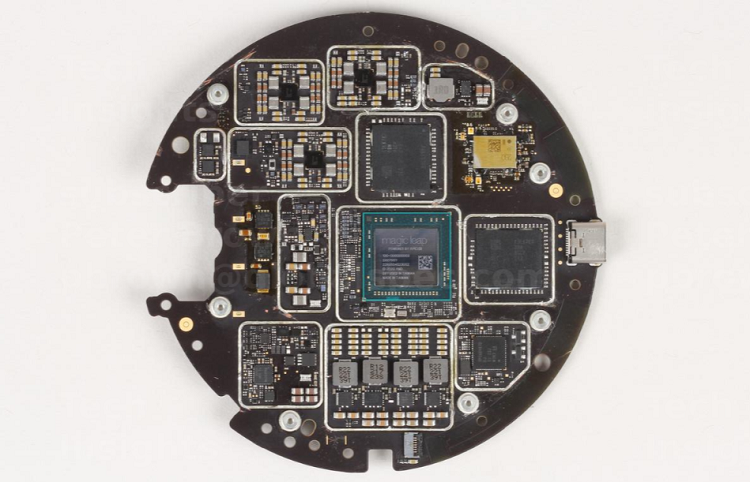 The main board houses the main processor from AMD and main memory from Samsung as well as other electronic components for control of the mixed reality device. Source: TechInsights 