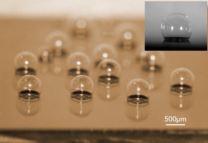 This is a chip-scale glass microspherical shell sensor array blown on a silicon substrate. Insert is a near-perfect spherical shell. Source: Tadigadapa Lab/Penn State
