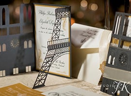 Figure 3: Platypus Papers used their Epilog laser for cutting and engraving intricate details into this Paris-themed wedding invitation. Source: Studio JK
