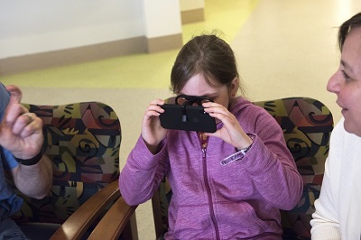 A patient experiences a new VR platform, HealthVoyager. Source: Boston Children's Hospital