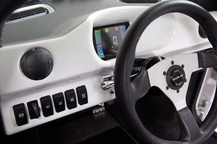 The inside of the SOLO includes an LCD instrument display, Bluetooth connectivity, rear-view backup camera and keyless entry. Source: Electra Meccanica Vehicles Corp. 
