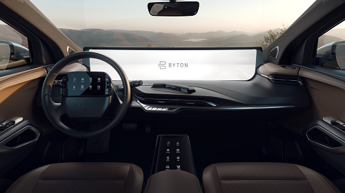 The interior of the M-Byte featuring touchscreens in the steering wheel and the large display. Source: Byton
