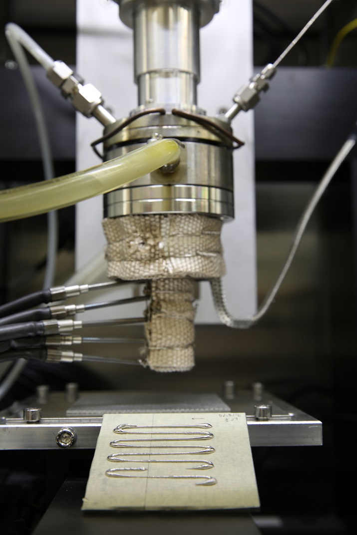 Direct metal writing using an ingot that is heated until it reaches a semi-solid state before it is forced through a nozzle. Source: Lawrence Livermore National Laboratory  