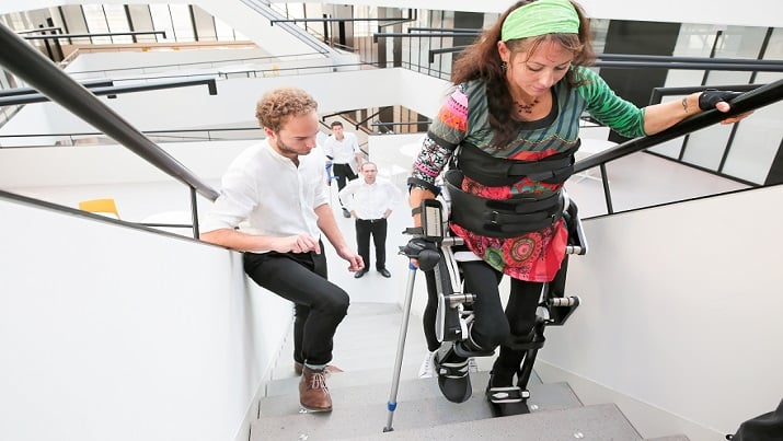 Silke Pan, climbing stairs with the Twiice Exoskeleton (Image Credit: EPFL)