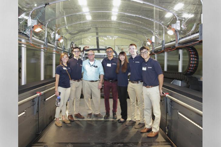 The team of engineering students who designed the cab were then invited to watch it take shape at ORNL. Image credit: ORNL 