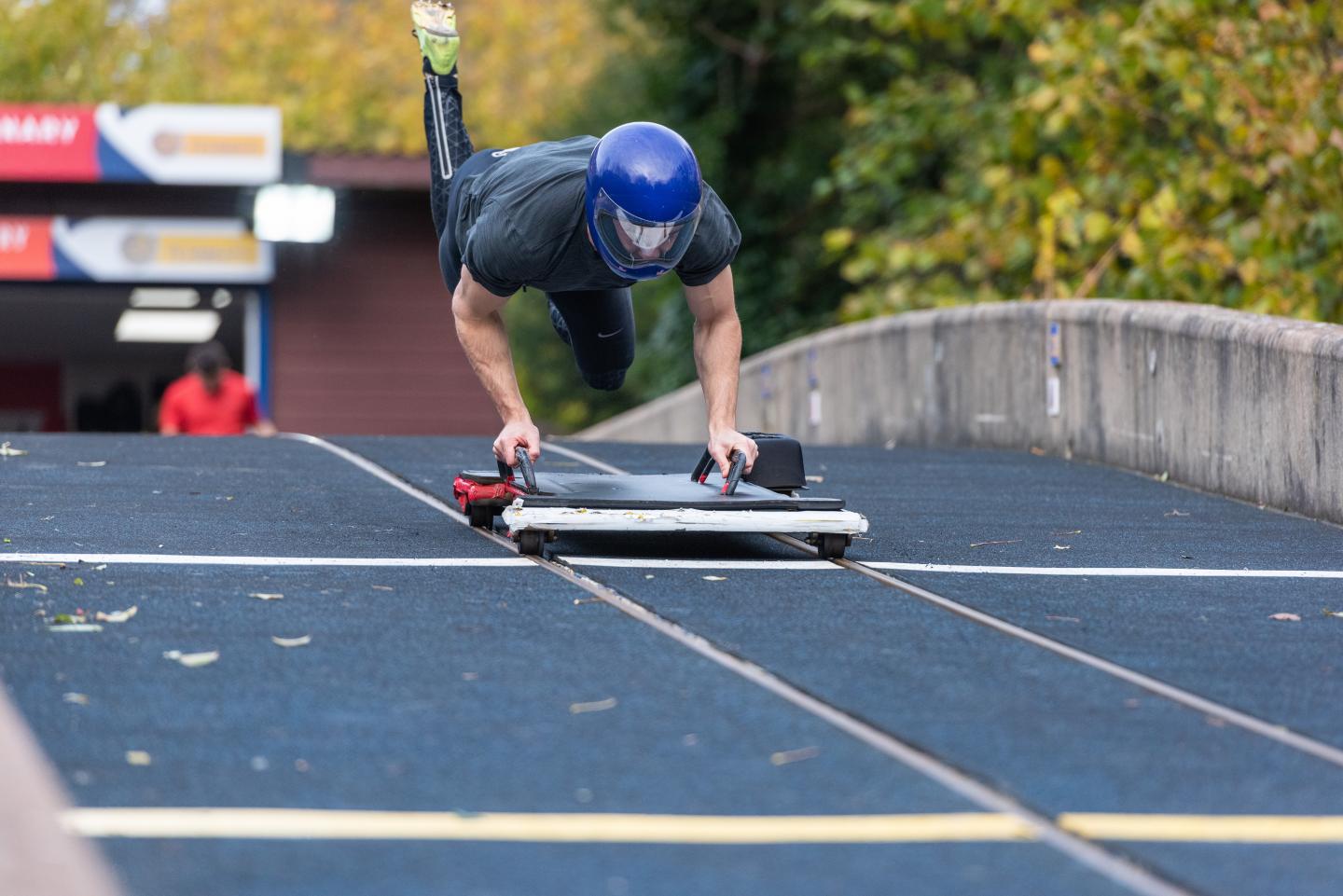 Athlete jumping onto a sled on a push start training track at the University of Bath. Source: University of Bath