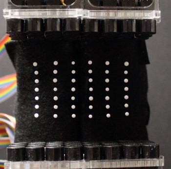 The pixels are levitated using a series of miniature ultrasound speakers that create high-pitched and high-intensity soundwaves that are inaudible but forceful enough to hold the spheres in place. They can be spun and flipped using electric force fields. (Image via University of Sussex)