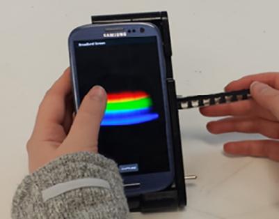 The spectral transmission-reflectance-intensity (TRI)-Analyzer attaches to a smartphone and analyzes patient blood, urine or saliva samples as reliably as clinic-based instruments that cost thousands of dollars. Source: Department of Bioengineering, University of Illinois at Urbana-Champaign