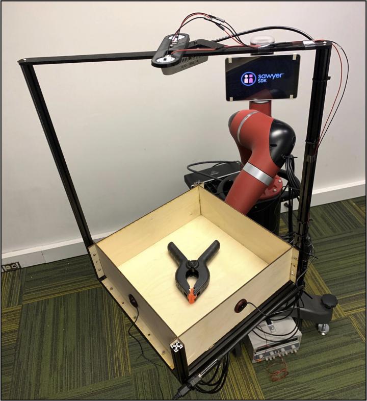 Carnegie Mellon University researchers devised an apparatus called Tilt-Bot to build a collection of actions, video and sound to improve robot perception. Source: Carnegie Mellon University