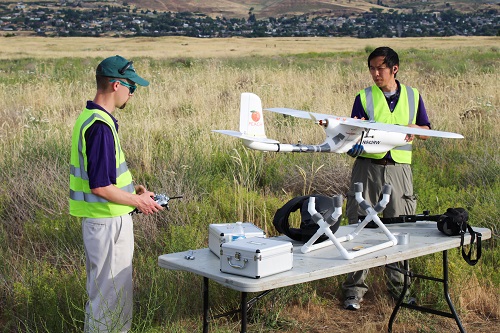Researcher work on a drone with a transponder that is used to send signals when GPS fails. Source: University of Washington