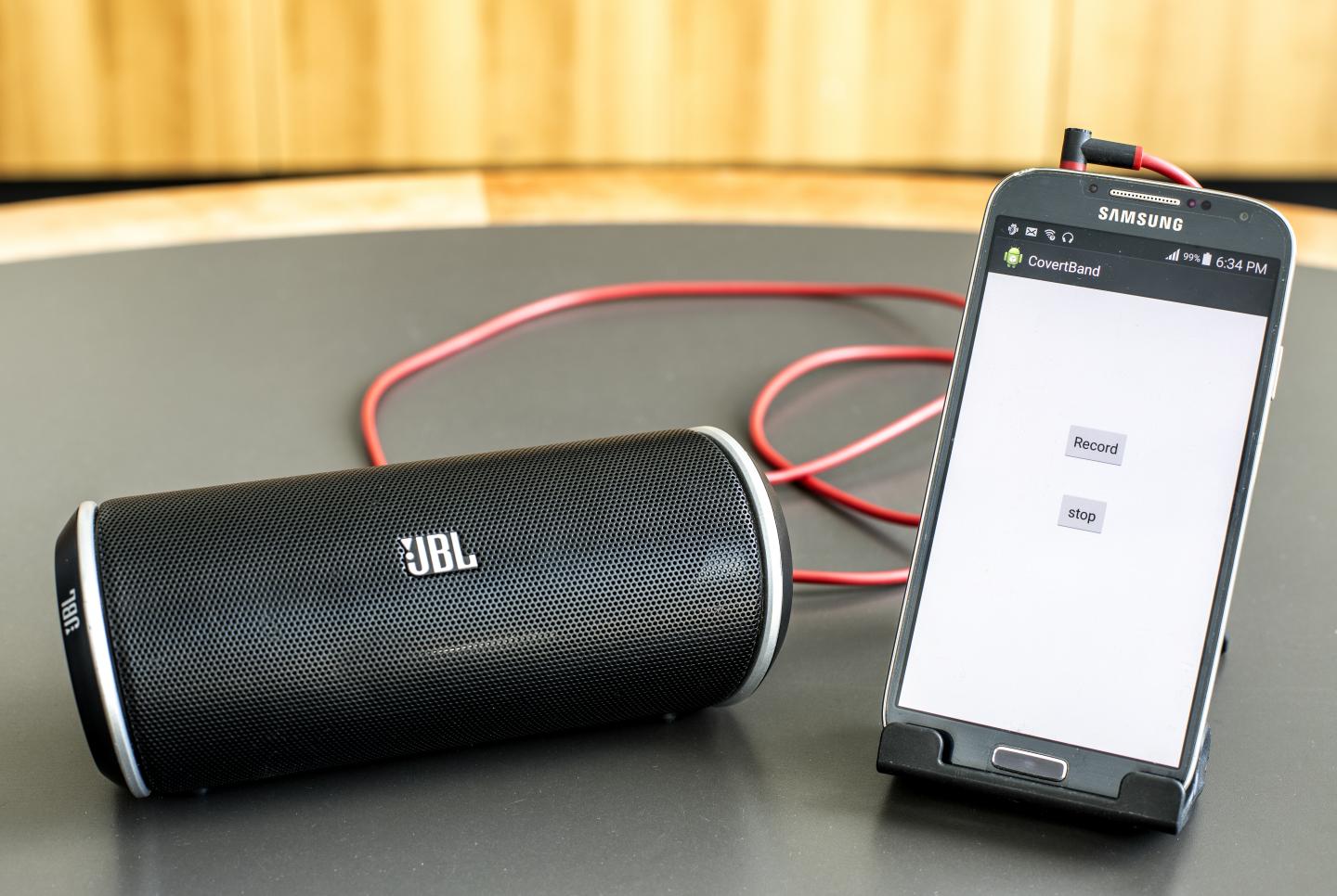 The researchers tested CovertBand using a Samsung Galaxy S4 smartphone hooked up to a portable speaker. (Dennis Wise/University of Washington)