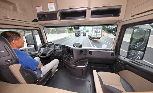 A human driver on-board a self-driving Xcient truck. Source: Hyundai