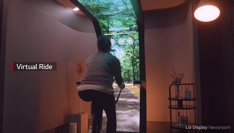 It’s an exercise bike and a ginormous display that brings the outdoors inside and allows people to take bike rides in places they may not be able to otherwise. Source: LG Display
