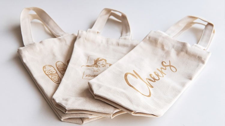 Figure 2: Small business owners tend to utilize a wide variety of materials for engraving projects. These canvas wine bags are just one of a virtually limitless number of possibilities. Source: Epilog Laser