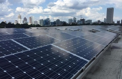 Photovoltaic panels are shown atop a building on the Georgia Institute of Technology campus. Source: John Toon
