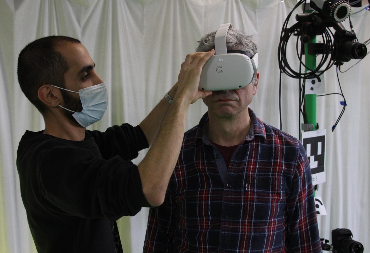 A volunteer is fitted with a VR headset. Source: University of Bath