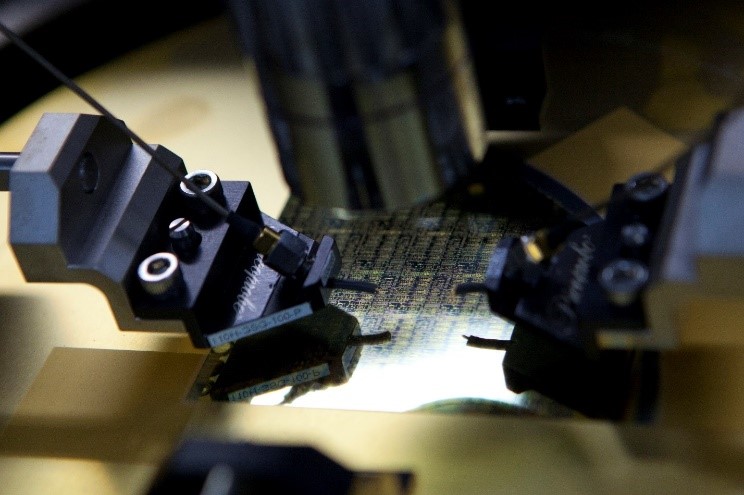 Figure 3. Chips are designed and sent to a foundry. Once obtained from the foundry, QuinStar probes each wafer to measure performance before dicing into chips for MMIC production. Source: QuinStar