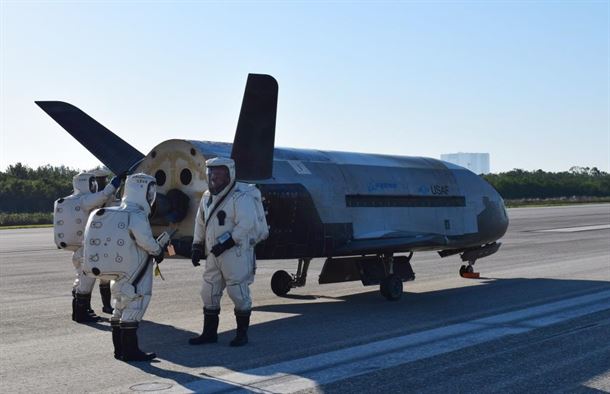 The X-37B under service on the runway.