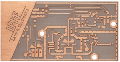 Figure 2. This photograph shows a bare FR-4 board laminated with a conductive metal, such as copper. This is an epoxy- based PCB material used for a wide range of analog and digital circuits (and prototypes). It can be laminated with conductive metal on one or both sides, for creating single- sided or double-sided circuit boards, respectively.