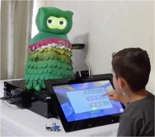 In this month-long, in-home study, child participants with ASD played math games on a touchscreen tablet, while a socially assistive robot used multimodal data to provide personalized feedback and instruction. Source: USC