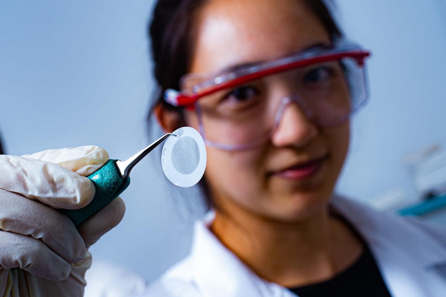 Rice University graduate student Natsumi Komatsu was the first to notice that the alignment of 2D carbon nanotube films corresponds to grooves in the filter paper beneath the films. Source: Jeff Fitlow/Rice University