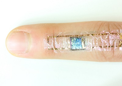 The flexible device on a finger. Source: RIKEN