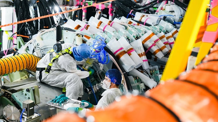 Helion engineers install a Polaris module. Source: Helion