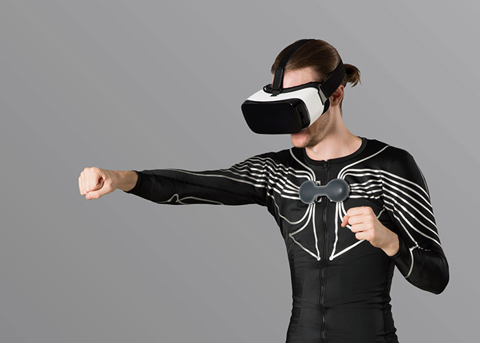 E-skin allows you to feel what’s happening in a virtual reality game or tells you how to better exercise. Source: Xenoma 