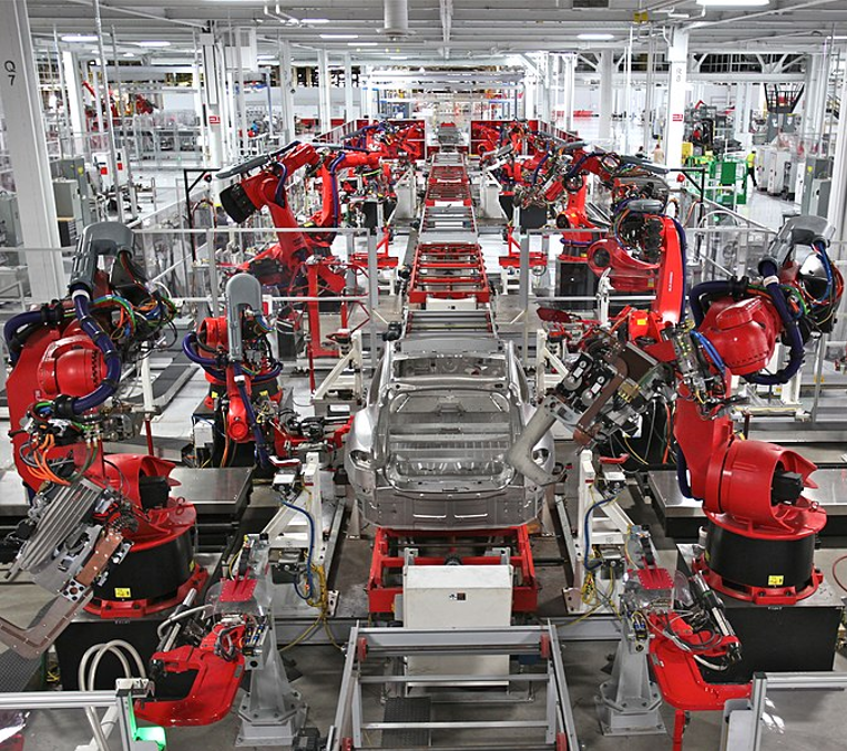 When people think of automation, they think of robot centers like this Tesla plant. Those robots are busy improving plant safety, quality and efficiency. Source: Steve Jurvetson/CC BY 2.0 